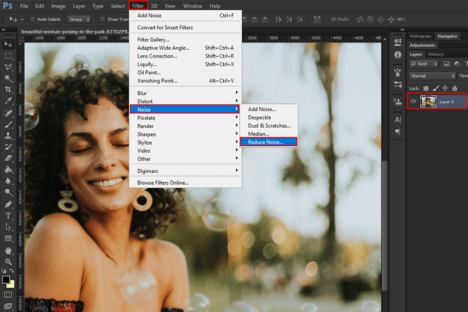 Showing how to remove grain from photo in Photoshop